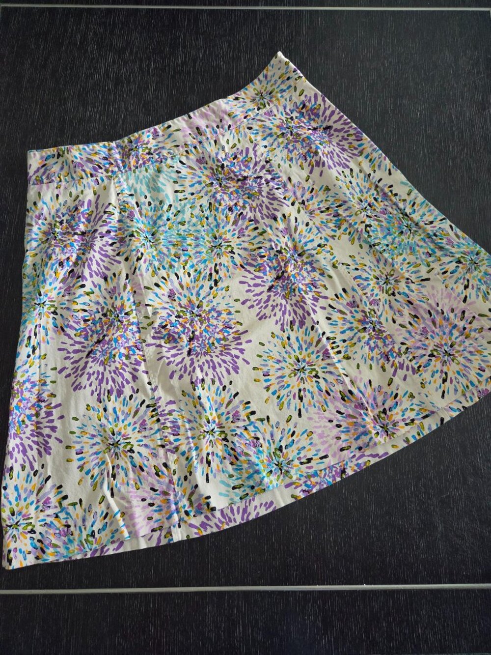 Lane Bryant circle skirt with purple and blue flower design on cream background